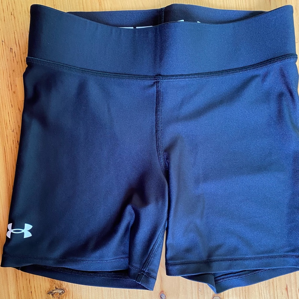 2 pairs. Women’s Under Armour training shorts. Size small. Navy and black.
